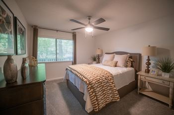 Bedroom with a large bed and a ceiling fan